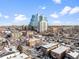 Elevated view of a city skyline with apartment buildings and snowy rooftops at 148 S Emerson St # 206, Denver, CO 80209