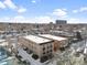 An aerial view captures a peaceful neighborhood with snow-covered rooftops and a clear sky at 148 S Emerson St # 206, Denver, CO 80209