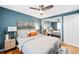 Stylish bedroom with a bed, nightstands, ample closet space, and soft lighting at 148 S Emerson St # 206, Denver, CO 80209
