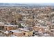 Expansive cityscape with a variety of buildings, trees, and a mountain range in the background at 148 S Emerson St # 206, Denver, CO 80209