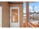 Unit entrance and balcony view with a brick facade and unit number 206 at 148 S Emerson St # 206, Denver, CO 80209
