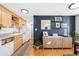 Updated kitchen with modern features including a breakfast bar, and hardwood floors at 148 S Emerson St # 206, Denver, CO 80209