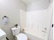 Clean bathroom featuring a white tiled shower-tub combination with modern fixtures at 3419 W Walsh Pl, Denver, CO 80219