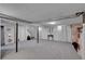 Large basement area with carpet, accent wall, and ample space for storage at 435 Cody Dr, Lakewood, CO 80226