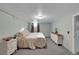 Finished basement bedroom offers soft carpet, white dressers, and warm, natural light at 435 Cody Dr, Lakewood, CO 80226