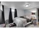 Basement bedroom features carpeting, black out curtains, and convenient side tables at 435 Cody Dr, Lakewood, CO 80226
