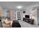 Finished basement with a cozy chair and television, offering a relaxing and inviting space at 435 Cody Dr, Lakewood, CO 80226