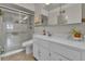 Bathroom featuring tile floor, glass shower and modern vanity at 435 Cody Dr, Lakewood, CO 80226