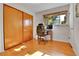 Bedroom featuring hardwood floors, closet, and a window providing natural light at 435 Cody Dr, Lakewood, CO 80226