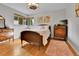 Bedroom featuring hardwood floors, neutral walls, and vintage furniture at 435 Cody Dr, Lakewood, CO 80226