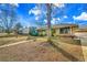 Home exterior with a walkway leading up to it, and a detached garage on the right at 435 Cody Dr, Lakewood, CO 80226