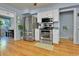 Kitchen with stainless steel appliances, white cabinets, and view into the adjacent dining room at 435 Cody Dr, Lakewood, CO 80226