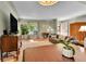 Interior of the living room showcasing the dining room, front door, and large window at 435 Cody Dr, Lakewood, CO 80226