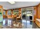 Sunroom boasting tiled floors, wood paneling, and sliding glass doors to the backyard at 435 Cody Dr, Lakewood, CO 80226