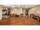 Spacious basement area featuring unique log pool table and custom wooden chairs at 3525 S Brentwood St, Lakewood, CO 80235