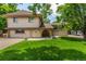 Charming two-story home with manicured lawn and unique brick portico at 3525 S Brentwood St, Lakewood, CO 80235