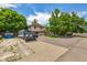 Two-story home with long driveway and parked machinery in large parking area at 3525 S Brentwood St, Lakewood, CO 80235