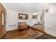 Inviting foyer with hardwood floors, bench seating, and staircase access at 3525 S Brentwood St, Lakewood, CO 80235