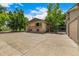 Large concrete parking area near the detached two-car garage with basketball hoop at 3525 S Brentwood St, Lakewood, CO 80235