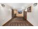 Cozy living room with wood paneling, entertainment center, and decorative lighting at 3525 S Brentwood St, Lakewood, CO 80235