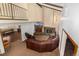 Spacious living room featuring vaulted ceilings, a fireplace, and comfortable seating area at 3525 S Brentwood St, Lakewood, CO 80235