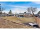 Large backyard features a patio, fire pit, and landscaping; perfect for outdoor living at 7266 S Birch St, Centennial, CO 80122