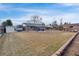 Spacious backyard with a patio, outdoor seating, shed, and RV parking space at 7266 S Birch St, Centennial, CO 80122
