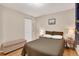 Comfortable bedroom with hardwood floors, closet, and neutral decor at 7266 S Birch St, Centennial, CO 80122