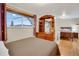 Bedroom boasts a large window, wood dresser, and a comfortable queen size bed, creating a cozy and inviting space at 7266 S Birch St, Centennial, CO 80122