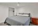 The bedroom includes a comfortable queen size bed, a large closet, and a stylish dresser for ample storage at 7266 S Birch St, Centennial, CO 80122