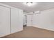 The bedroom features neutral walls and carpeting, along with ample closet space for storage at 7266 S Birch St, Centennial, CO 80122