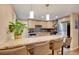 Bright kitchen with stainless steel appliances, wooden cabinets, and granite countertops at 7266 S Birch St, Centennial, CO 80122