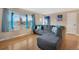 Cozy living room with hardwood floors, large window, and comfortable seating at 7266 S Birch St, Centennial, CO 80122
