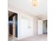 Bedroom with carpet, closet, chandelier, and entryways to hall and bathroom at 13812 W 64Th Pl, Arvada, CO 80004