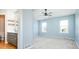 Spacious bedroom with vaulted ceiling, ceiling fan, and ensuite bathroom at 13812 W 64Th Pl, Arvada, CO 80004