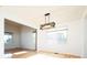 Open dining space boasts hardwood floors, modern lighting, and seamless flow to other areas at 13812 W 64Th Pl, Arvada, CO 80004