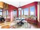 Bright dining room with glass table, modern chandelier, and scenic views at 8456 N Sundown Trl, Parker, CO 80134