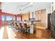 Stylish kitchen showcasing custom wood cabinetry, stainless steel appliances, and a spacious center island at 8456 N Sundown Trl, Parker, CO 80134