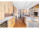 Open kitchen featuring wood cabinetry, stainless steel appliances, and stone countertops at 8456 N Sundown Trl, Parker, CO 80134