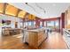 Expansive kitchen with granite counters, stainless appliances and an island cooktop at 8456 N Sundown Trl, Parker, CO 80134