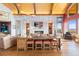 Open-concept living area featuring a stone accent wall with fireplace and stylish furnishings at 8456 N Sundown Trl, Parker, CO 80134