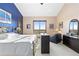 Well-lit bedroom with furniture, carpet floors, and a scenic view at 8456 N Sundown Trl, Parker, CO 80134