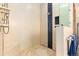 Walk-in shower with stone flooring, tiled walls, glass partition, and modern fixtures at 8456 N Sundown Trl, Parker, CO 80134