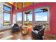 Bright sitting area with a view, featuring cozy armchairs and unique decorative elements at 8456 N Sundown Trl, Parker, CO 80134