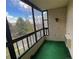 Enclosed balcony with views of trees and the outdoors at 13992 E Marina Dr # 303, Aurora, CO 80014