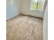 Light-filled carpeted bedroom with a window and wall heater at 13992 E Marina Dr # 303, Aurora, CO 80014
