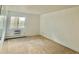 Bedroom with a window and wall-mounted AC unit at 13992 E Marina Dr # 303, Aurora, CO 80014