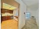 Bright kitchen featuring wood cabinets, stainless steel appliances, and an opening to the carpeted living room at 13992 E Marina Dr # 303, Aurora, CO 80014