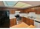 Well-lit kitchen showcases wood cabinets, stainless steel appliances, and black refrigerator at 13992 E Marina Dr # 303, Aurora, CO 80014