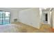Living room with carpet, a sliding glass door to the balcony, and baseboard heating at 13992 E Marina Dr # 303, Aurora, CO 80014
